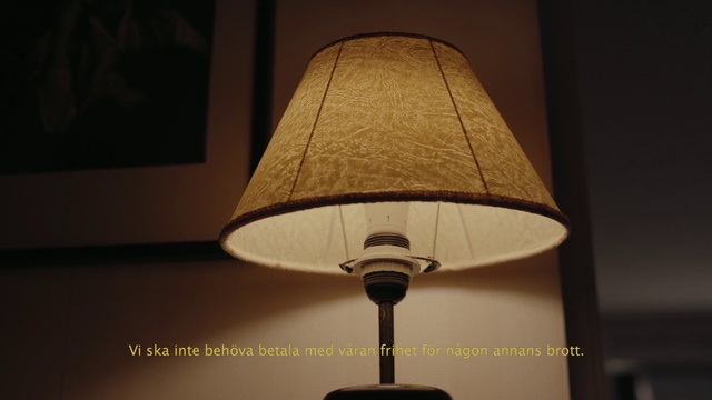 Video Reference: Light, Lamp, Shade, Wood, Table, Facial hair, Tints and shades, Glass, Metal, Ceiling fixture