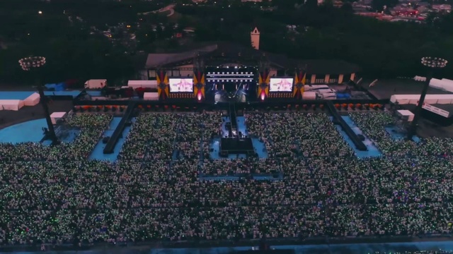 Video Reference: World, Grass, Landmark, Electric blue, Event, Entertainment, Stage, Space, Landscape, Crowd