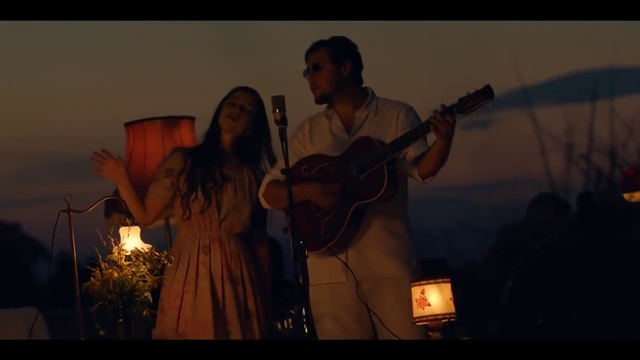Video Reference: Microphone, Musical instrument, Guitar, Musician, String instrument, String instrument, Plucked string instruments, Sky, Guitar accessory, Public address system