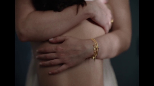 Video Reference: Clothing, Hand, Arm, Shoulder, Body jewelry, Neck, Human body, Waist, Gesture, Thigh