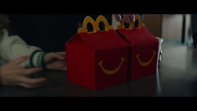 Video Reference: takeout, food packaging, fast food, red boxes, table, hands, restaurant, meal, packaging, delivery, snack, indoor