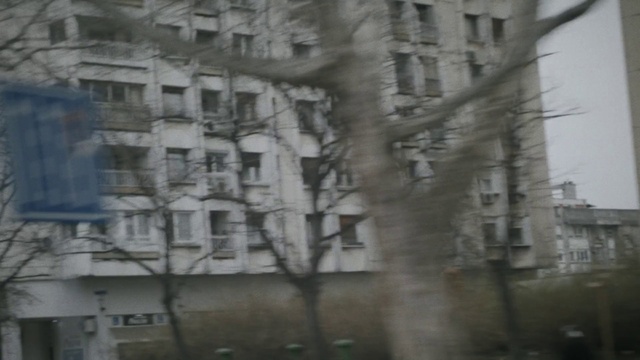 Video Reference: Building, Window, Branch, Grey, Fixture, Tower block, Urban design, Twig, Condominium, Facade