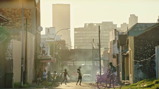 Video Reference: Building, Wheel, Tire, Sky, Atmospheric phenomenon, Neighbourhood, Tower block, Urban design, Tints and shades, City