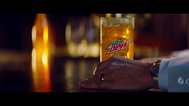Video Reference: Watch, Amber, Beer, Gesture, Drink, Automotive lighting, Tableware, Drinkware, Alcoholic beverage, Beer glass
