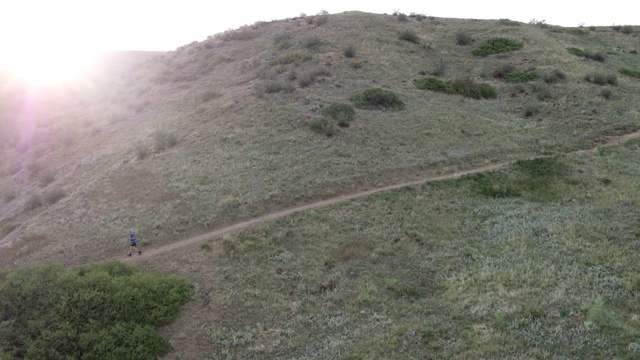 Video Reference: Plant community, Mountain, Plant, Slope, Sky, Natural landscape, Terrain, Grass, Grassland, Landscape