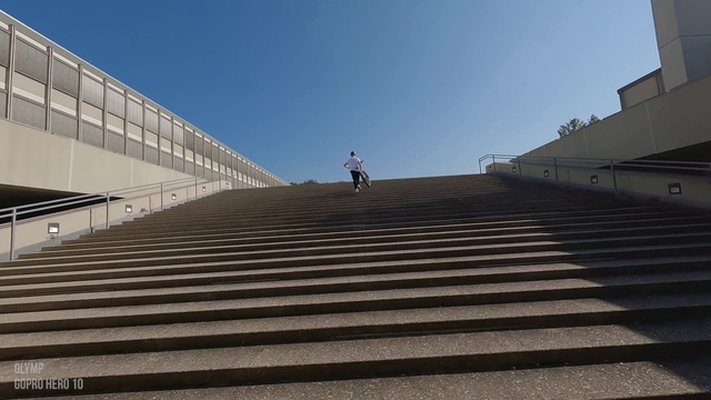 Video Reference: Sky, Stairs, Road surface, Asphalt, Road, Composite material, Symmetry, City, Walkway, Roof