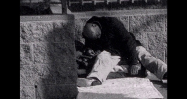 Video Reference: Monochrome photography, Monochrome, Hat, Sitting, Concrete, Rock, Recreation, History, Flooring