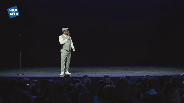 Video Reference: Suit trousers, Performing arts, Entertainment, Event, Fashion design, Performance art, Darkness, Music artist, Public event, Public speaking