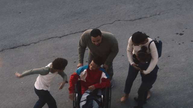 Video Reference: Shorts, Gesture, Road surface, Asphalt, Fun, Event, Leisure, Road, Recreation, Sitting