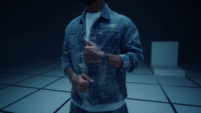 Video Reference: Shoulder, Blue, Dress shirt, Flash photography, Sleeve, Gesture, Eyewear, Grey, Collar, Elbow