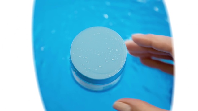 Video Reference: Hand, Liquid, Azure, Fluid, Finger, Plastic bottle, Paint, Circle, Electric blue, Nail