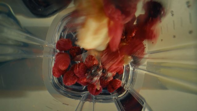 Video Reference: blender, fruit, berries, smoothie, mixing, food, kitchen, close-up, top-down, fresh, red, motion blur, healthy, recipe