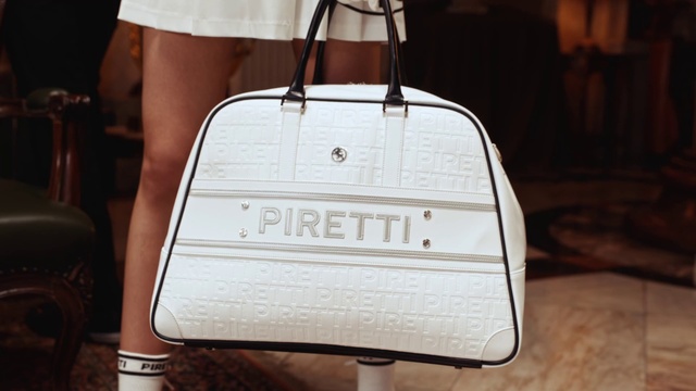 Video Reference: Photograph, White, Wood, Font, Gas, Shoulder bag, Metal, Rectangle, Fashion accessory, Composite material