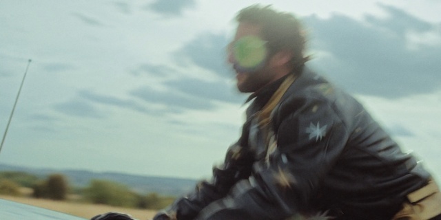 Video Reference: Cloud, Sky, Helmet, Jacket, Travel, Landscape, Personal protective equipment, Grass, Glove, Wilderness