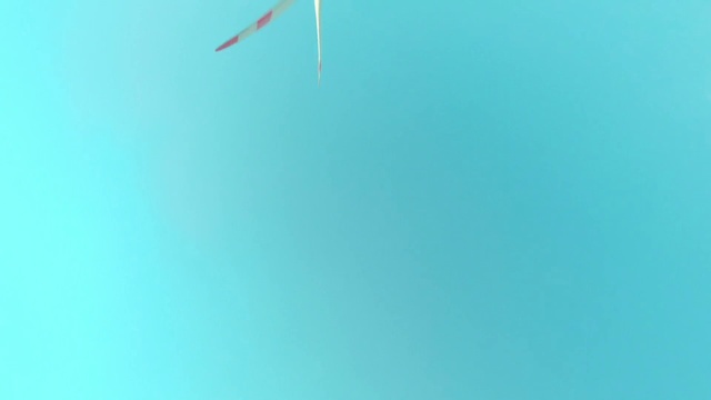 Video Reference: Sky, Aqua, Electric blue, Tints and shades, Wind, Font, Fashion accessory, Triangle, Pattern, Peach