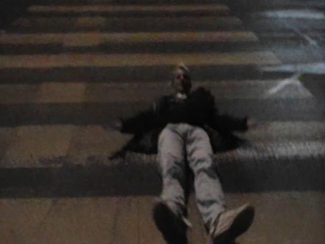 Video Reference: Grey, Floor, Asphalt, Flooring, Tints and shades, Wood, Road surface, Art, Personal protective equipment, Darkness