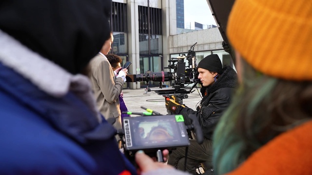 Video Reference: Jacket, Window, Engineering, Videographer, Recreation, Event, Hat, T-shirt, Conversation, Job