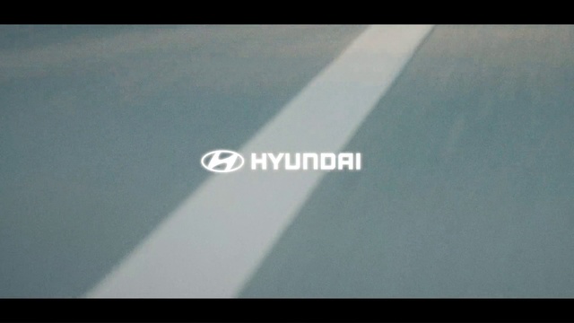 Video Reference: Font, Asphalt, Rectangle, Automotive exterior, Gadget, Wood, Display device, Triangle, Electric blue, Logo