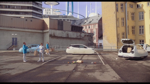 Video Reference: Car, Vehicle, Building, Window, Motor vehicle, Infrastructure, Automotive lighting, Automotive design, Road surface, Asphalt