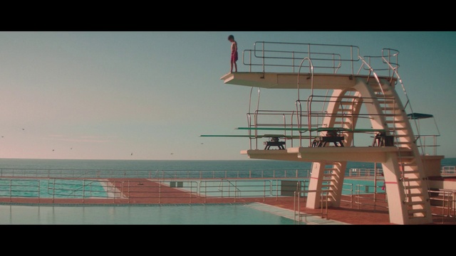 Video Reference: Sky, Building, Street light, Rectangle, Urban design, Facade, Naval architecture, City, Wood, Metal