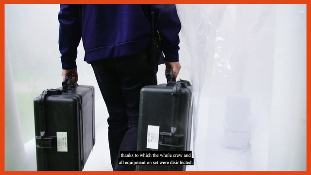 Video Reference: Sleeve, Bag, Luggage and bags, Travel, Street fashion, Waist, Font, Rolling, Blazer, Human leg