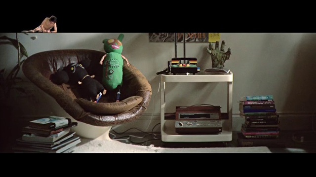 Video Reference: Couch, Comfort, Living room, Table, Toy, Office equipment, Automotive design, Shelving, Room, Gadget