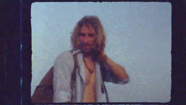 Video Reference: Beard, Entertainment, Facial hair, Event, Microphone, Speech, Display device, Fun, Projection screen, Rectangle