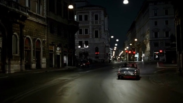 Video Reference: Building, Window, Vehicle, Car, Automotive lighting, Infrastructure, Road surface, Headlamp, Sky, Street light