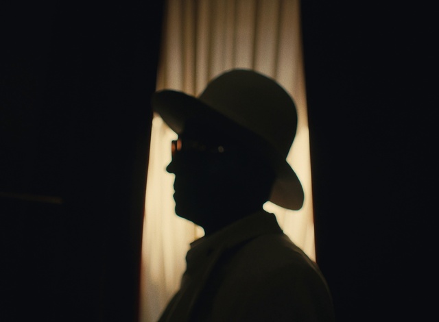 Video Reference: Hat, Flash photography, Sun hat, Cap, Fedora, Eyewear, Tints and shades, Facial hair, Curtain, Entertainment