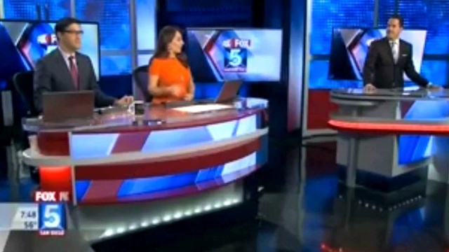 Video Reference: Clothing, Television presenter, Television, Product, Blue, Output device, Table, Television program, News, Television set