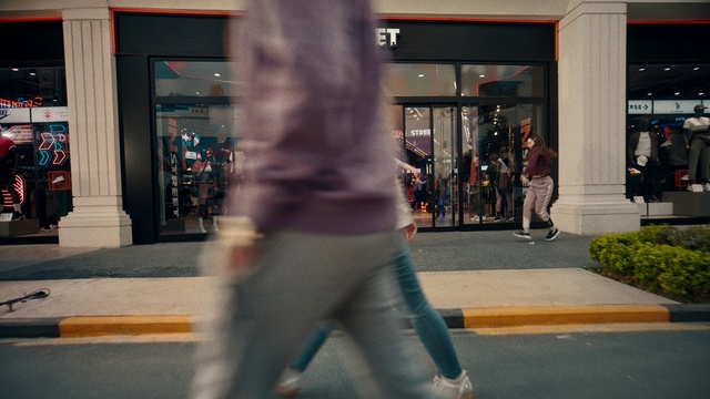 Video Reference: Plant, Waist, Street fashion, Thigh, Road surface, Sidewalk, City, Tints and shades, Trunk, Knee