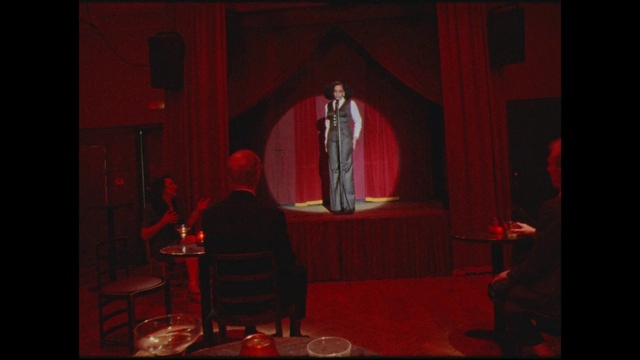 Video Reference: Entertainment, Chair, Performing arts, Curtain, Interior design, Theater curtain, Music, Performance art, Music venue, Suit