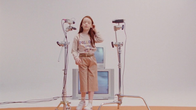 Video Reference: Smile, Shoulder, Microphone, Leg, Public address system, Musician, Knee, Audio equipment, Microphone stand, Flooring