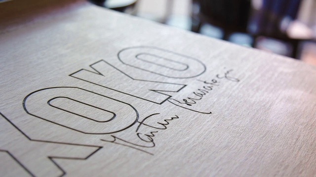 Video Reference: Wood, Gesture, Grey, Font, Material property, Close-up, Tree, Pattern, Drawing, Number