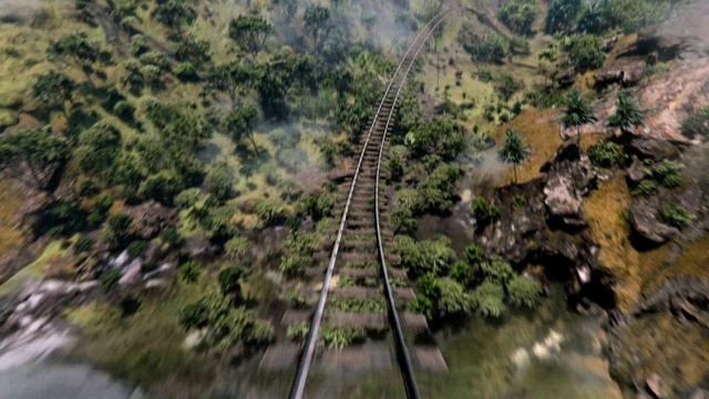Video Reference: Terrestrial plant, Track, Vehicle, Slope, Plant, Grass, Railway, Mountain, Natural landscape, Tree