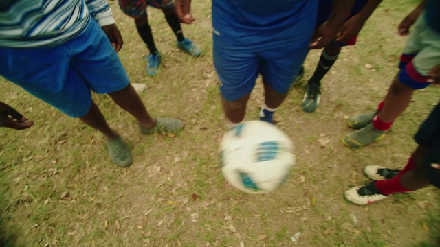 Video Reference: Shorts, Shoe, Leg, Soccer, Football, Sports equipment, Ball, Sneakers, Grass, Player