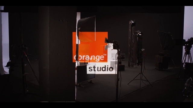 Video Reference: Chair, Font, Event, Entertainment, Display device, Darkness, Stage equipment, Brand, Logo, Automotive design