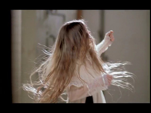Video Reference: person, back view, long hair, motion, indoor, hair movement, soft light, portrait, turning, blurry background