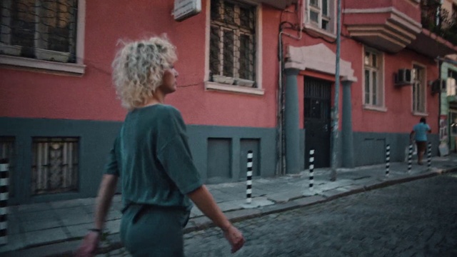 Video Reference: Window, Temple, Road surface, Street fashion, Wood, Door, Sidewalk, Travel, Tints and shades, Leisure