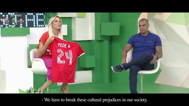 Video Reference: Shoe, Standing, Gesture, Leisure, Font, Comfort, T-shirt, Fashion design, Chair, Recreation