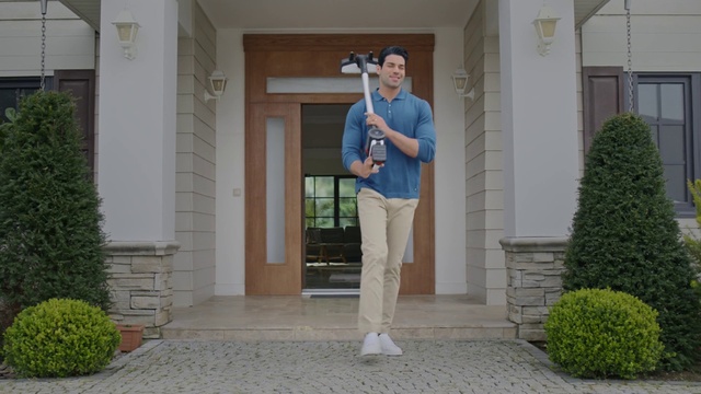 Video Reference: Plant, Outerwear, Property, Shoulder, Building, Green, House, Door, Standing, Architecture