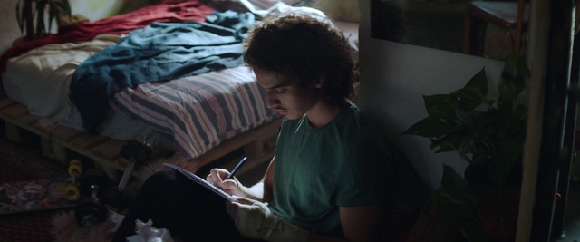 Video Reference: Couch, Comfort, Plant, Eyewear, Flash photography, T-shirt, Gadget, Darkness, Audio equipment, Fun