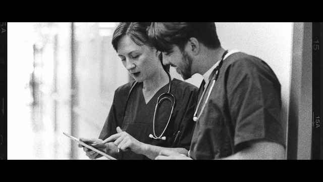 Video Reference: Flash photography, Sleeve, Black-and-white, Gesture, Style, Stethoscope, Font, Happy, T-shirt, Monochrome