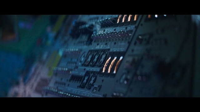 Video Reference: Font, Electric blue, Darkness, Space, Engineering, Display device, Audio equipment, Windshield, City, Auto part
