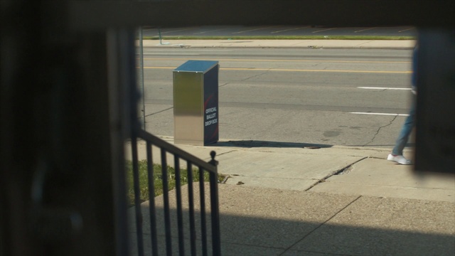 Video Reference: Road surface, Asphalt, Shade, Sidewalk, Parking, Gas, Rectangle, Tints and shades, Vehicle door, Road