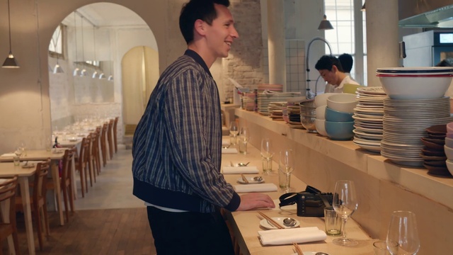 Video Reference: Table, Furniture, Tableware, Fashion, Sleeve, Interior design, Smile, Chair, Drinkware, Window