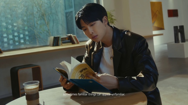 Video Reference: Tableware, Book, Publication, Chair, Sitting, White-collar worker, Job, Reading, Serveware, Room