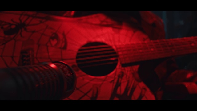 Video Reference: Guitar accessory, Automotive lighting, Font, Guitar, Plucked string instruments, Musical instrument, Tints and shades, Art, Automotive design, String instrument accessory