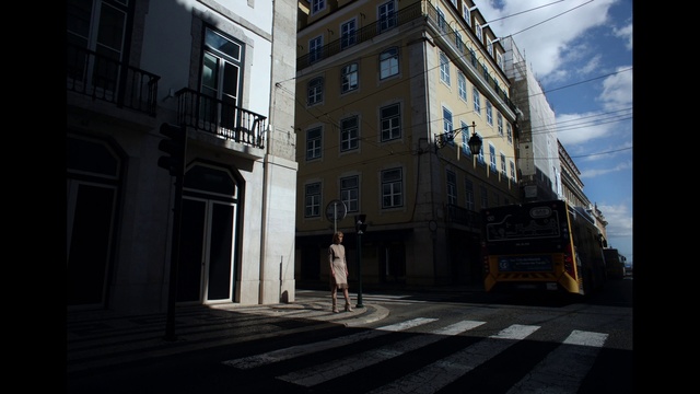 Video Reference: Building, Sky, Cloud, Window, Road surface, Urban design, House, Road, Facade, City
