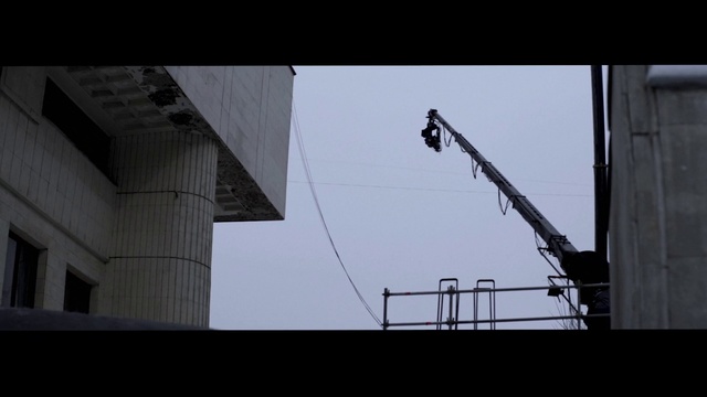 Video Reference: Sky, Building, Composite material, Crane, Rectangle, Wire, Building material, Metal, Roof, Symmetry